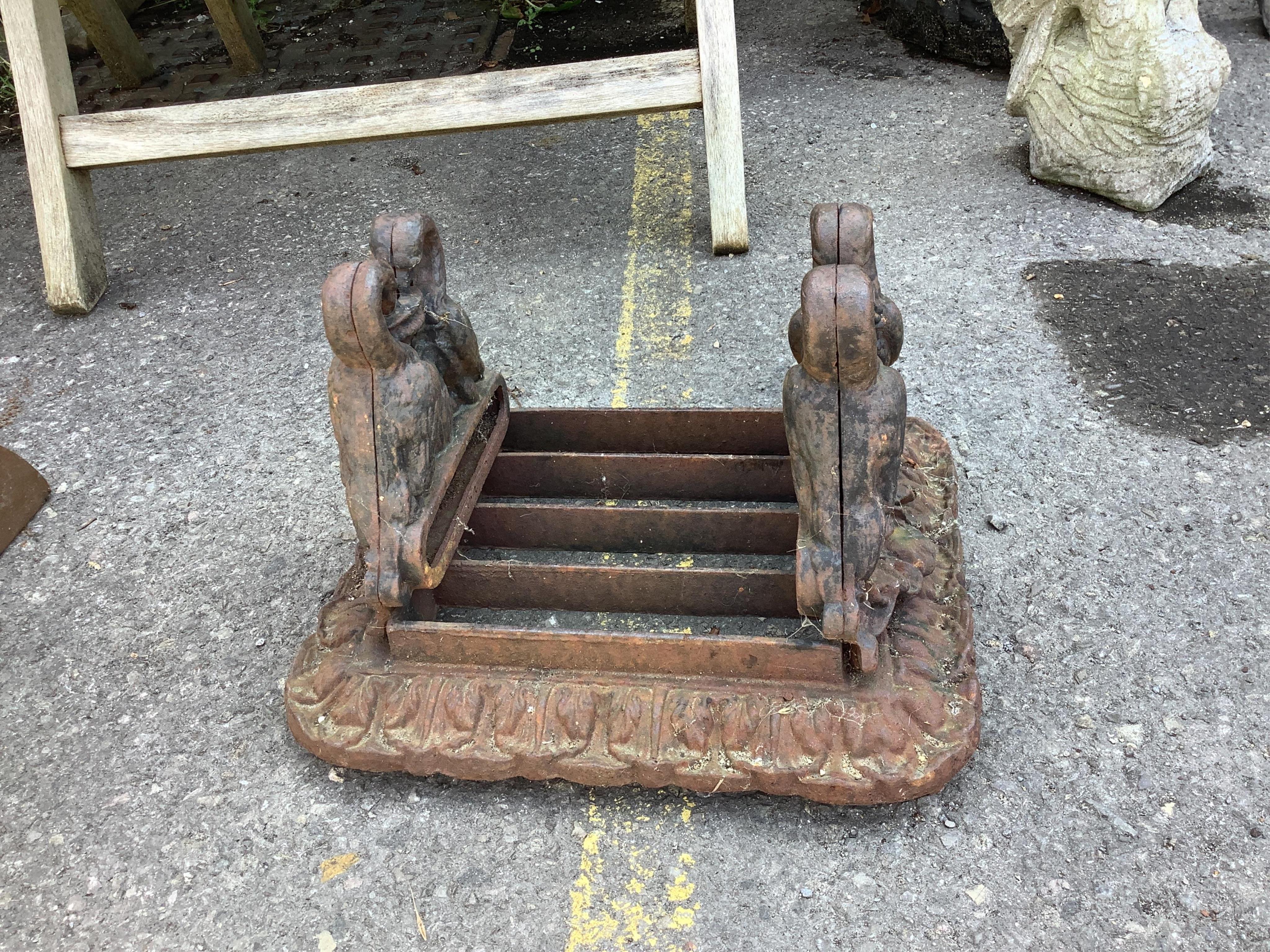 Two Victorian cast iron boot-scrapers, larger width 35cm, depth 25cm, height 20cm. Condition - poor